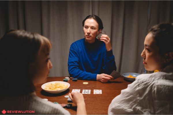 a person with a poker face while playing poker