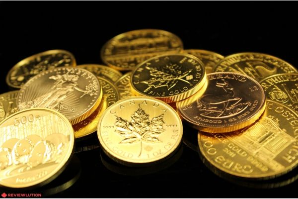 gold coins on a black surface