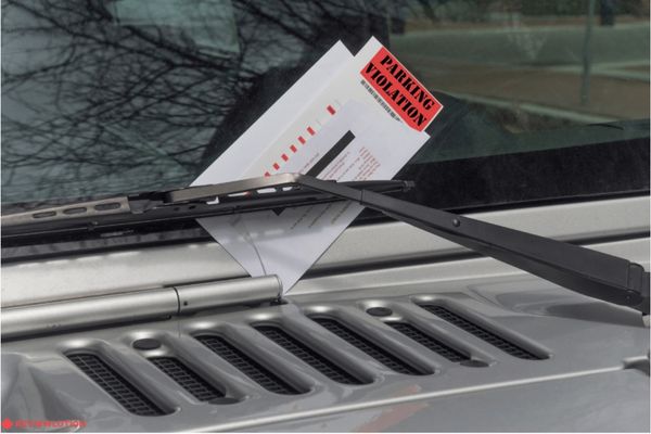parking violation ticket on a windshield 