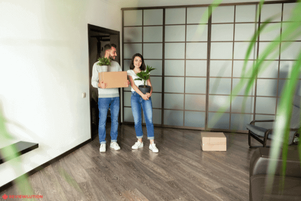 two-people-moving-into-an-apartment