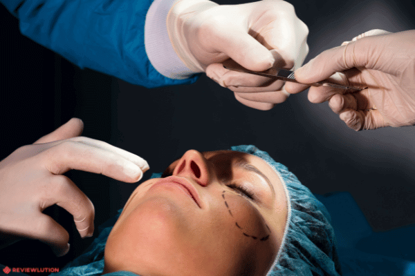 a doctor performing plastic surgery on a woman