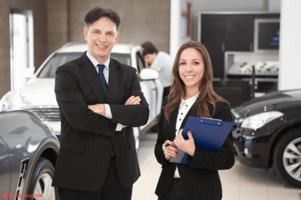 car salespeople in a car dealership
